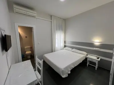 Cama o camas de una habitación en Hostal Venta Del Sol