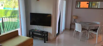 Una televisión o centro de entretenimiento en Vera Playa Naturista Michel