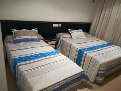 Cama o camas de una habitación en Hostal Sol Bahía San José