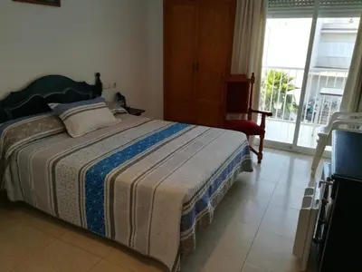Cama o camas de una habitación en Hostal Sol Bahía San José