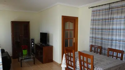 Una televisión o centro de entretenimiento en Vera Rental Thalassa II