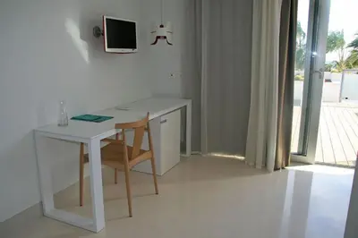 Una televisión o centro de entretenimiento en Hotel Las Palmas