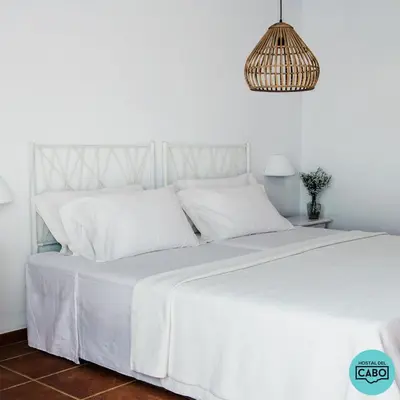 Cama o camas de una habitación en Hostal del Cabo