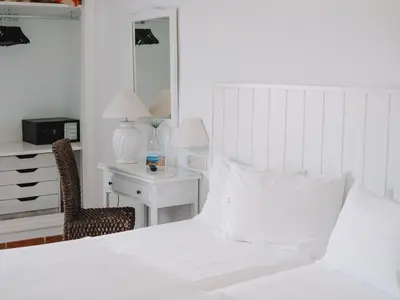 Cama o camas de una habitación en Hostal del Cabo