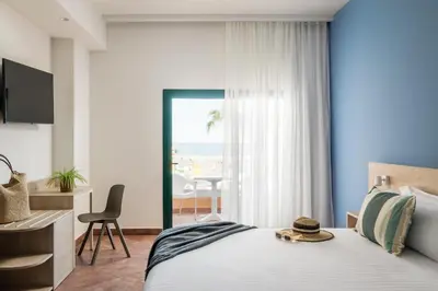 Cama o camas de una habitación en ALEGRIA Colonial Mar Aquafun