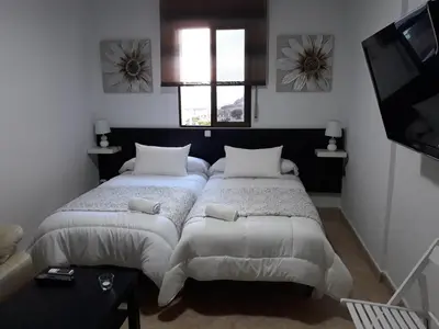 Cama o camas de una habitación en Miramar Habitaciones