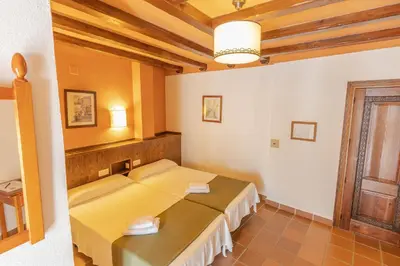 Cama o camas de una habitación en Hotel La Fragua I