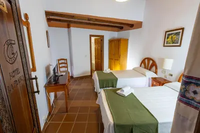 Cama o camas de una habitación en Hotel La Fragua I