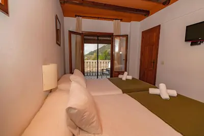 Cama o camas de una habitación en Hotel La Fragua I