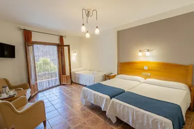 Cama o camas de una habitación en Hotel La Fragua II