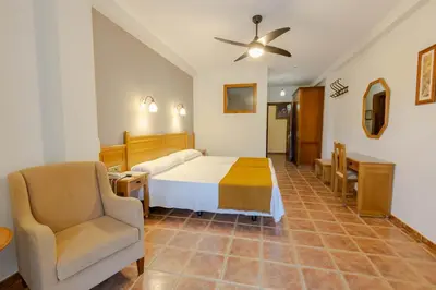 Cama o camas de una habitación en Hotel La Fragua II