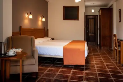 Cama o camas de una habitación en Hotel La Fragua II