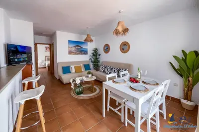 Una televisión o centro de entretenimiento en El Velero - Vacaciones inolvidables frente el MAR