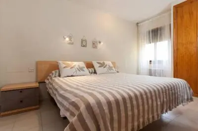 Cama o camas de una habitación en Roquetas Beach