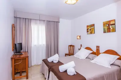 Cama o camas de una habitación en Miramar