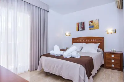 Cama o camas de una habitación en Miramar