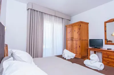 Cama o camas de una habitación en Miramar