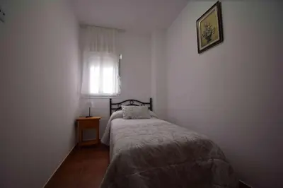 Cama o camas de una habitación en Apartamentos Horno y Casa De Dulce