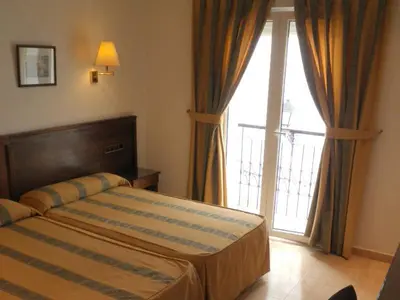 Cama o camas de una habitación en Hotel Tio Felipe
