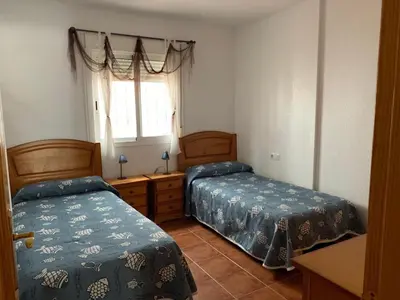 Cama o camas de una habitación en El jardín de La Isleta