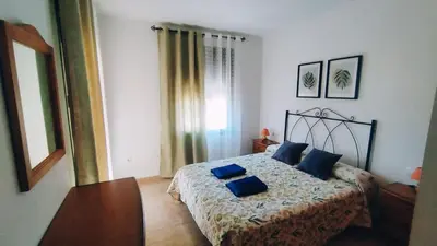 Cama o camas de una habitación en Apartamentos Turísticos Edificio del Pino