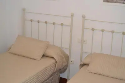 Cama o camas de una habitación en Primera línea playa