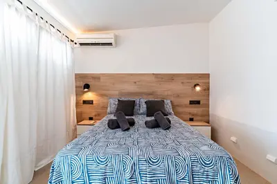 Cama o camas de una habitación en Bungalow 29 PIE DE PLAYA