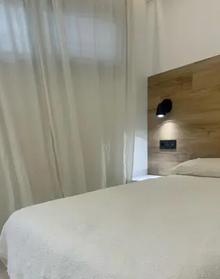 Cama o camas de una habitación en Bungalow 29 PIE DE PLAYA