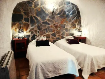 Cama o camas de una habitación en Cuevas Andalucia