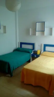Cama o camas de una habitación en Primerísima línea de playa