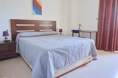 Cama o camas de una habitación en Alojamiento Particular