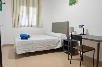 Cama o camas de una habitación en Alojamiento Particular