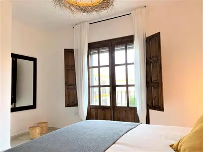Cama o camas de una habitación en Eonia Marinas-Dúplex con porche en primera línea!