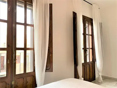 Cama o camas de una habitación en Eonia Marinas-Dúplex con porche en primera línea!
