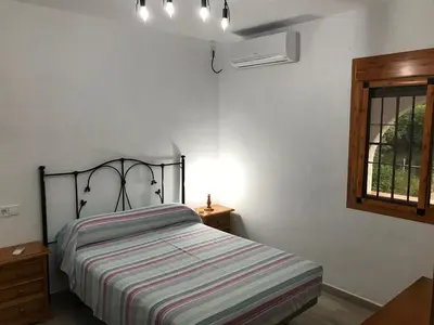 Cama o camas de una habitación en El cortijo de la abuela