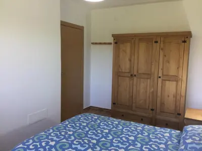 Cama o camas de una habitación en El cortijo de la abuela