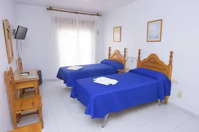 Cama o camas de una habitación en Pensión Felipe