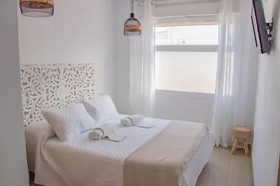 Cama o camas de una habitación en H Rincón de Diego
