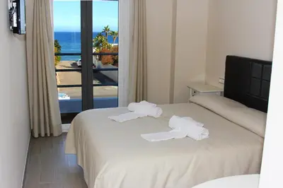 Cama o camas de una habitación en H Rincón de Diego