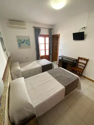 Cama o camas de una habitación en Hotel Simón
