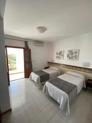 Cama o camas de una habitación en Hotel Simón