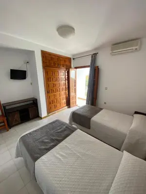 Cama o camas de una habitación en Hotel Simón