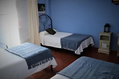 Cama o camas de una habitación en Hostal Arco Plaza