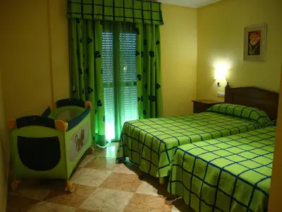 Cama o camas de una habitación en Hotel Lucero