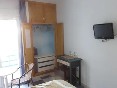 Una televisión o centro de entretenimiento en Hostal Puerto Genovés