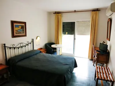 Cama o camas de una habitación en Hostal Brisamar