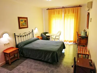 Cama o camas de una habitación en Hostal Brisamar