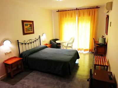 Cama o camas de una habitación en Hostal Brisamar