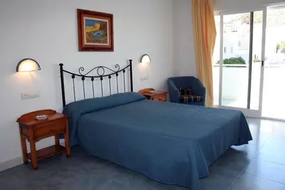 Cama o camas de una habitación en Hostal Brisamar