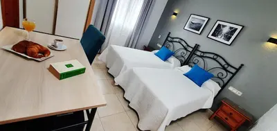 Cama o camas de una habitación en Hostales Juan de Austria I & II